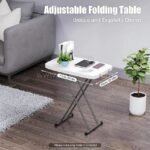 Folding coffee table with dimensions displayed, highlighting its compact yet spacious design.