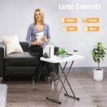 Spacious folding coffee table with a white surface, used as a living room centerpiece with coffee, decor, and a book.