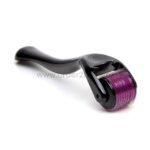 A sleek black derma roller with an ergonomic handle and vibrant purple roller head featuring fine, densely packed needles for a painless microneedling experience.