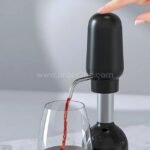 Automatic wine aerator & dispenser pouring red wine into a glass highlighting precise dispensing feature