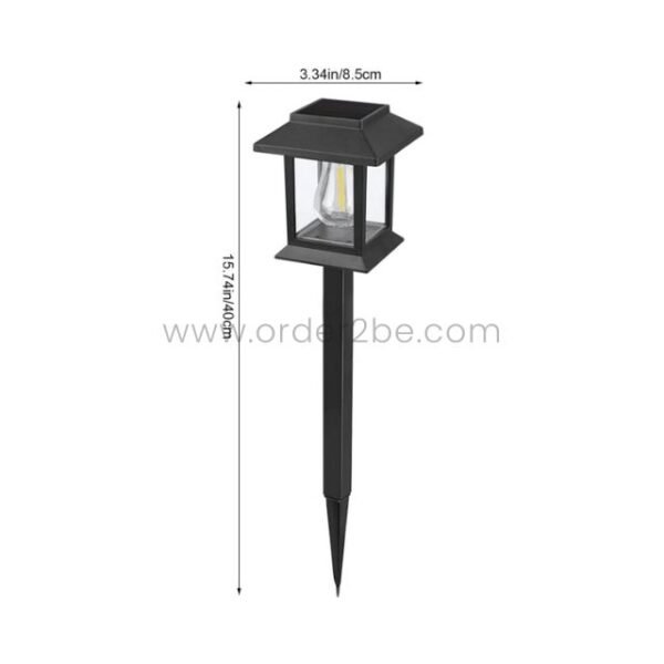 A compact black solar garden pathway light with a sleek, lantern-style design and pointed stake.