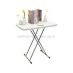 Stylish white folding coffee table with X-shaped legs, decorated with vases and books.