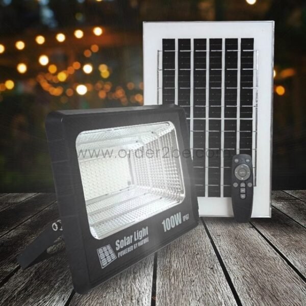 GD SUPER 100W solar flood light illuminating an outdoor area at night.