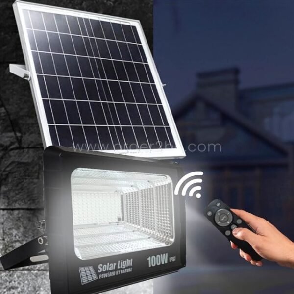 GD SUPER 100W solar flood light with remote control, mounted on a wall for outdoor illumination.