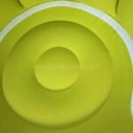 Detailed shot of the chair’s soft green cushion.