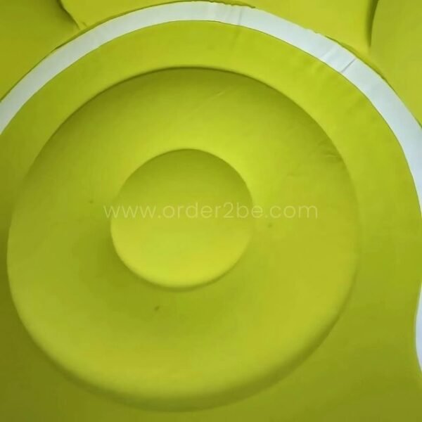 Detailed shot of the chair’s soft green cushion.