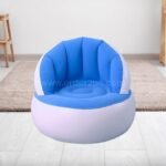 A sleek blue inflatable chair in a simple, modern room.