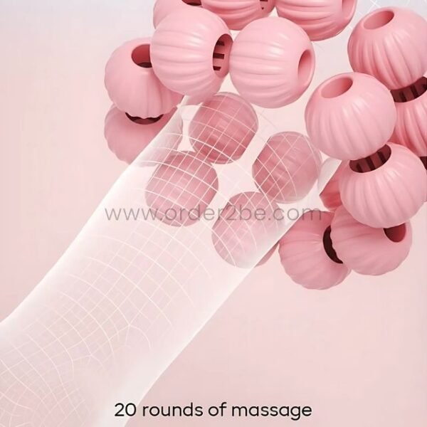 Close-up view of the pink leg massager’s rollers as they glide smoothly over a person’s arm, showcasing its 20 rounds of massage.