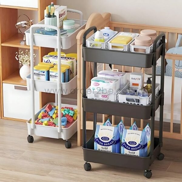 3-tier rolling organizer rack filled with baby essentials like diapers, formula, and snacks near a crib in a nursery.