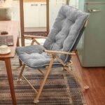 A comfortable camping recliner chair placed in a modern home office setting, highlighting its dual use for indoor and outdoor environments.