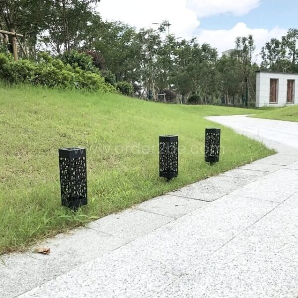 Creative solar garden lights placed along a park pathway, demonstrating their versatility and ability to enhance public spaces.