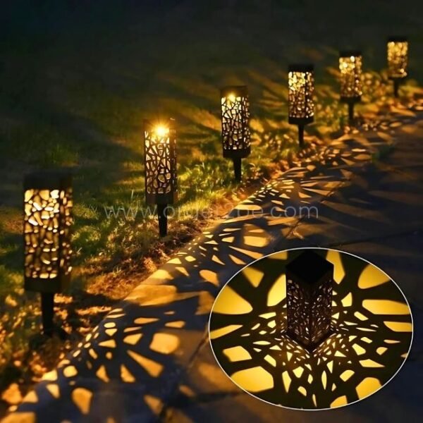 Creative solar garden lights casting mesmerizing shadows on a garden pathway, enhancing the ambiance.