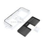 Disassembled shower caddy with modular parts: white base, black tray, and additional components.