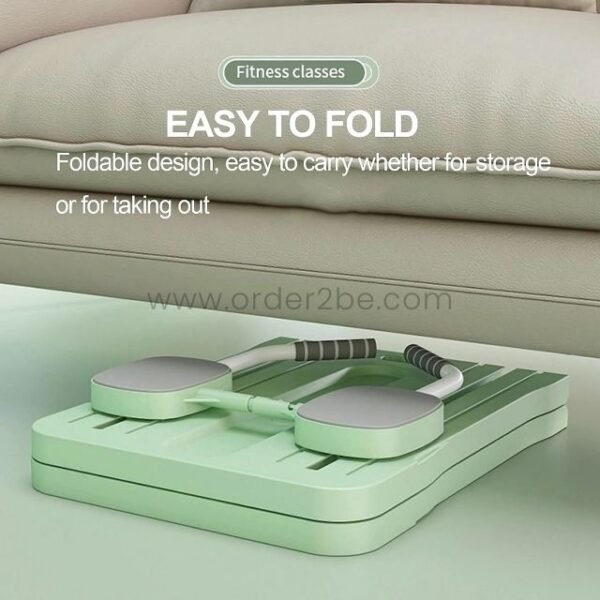 A green multifunctional exercise board folded neatly under a couch, demonstrating its easy-to-store design.