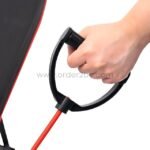 A hand gripping the handle of a resistance band attached to an adjustable full-body workout bench, demonstrating its versatility.