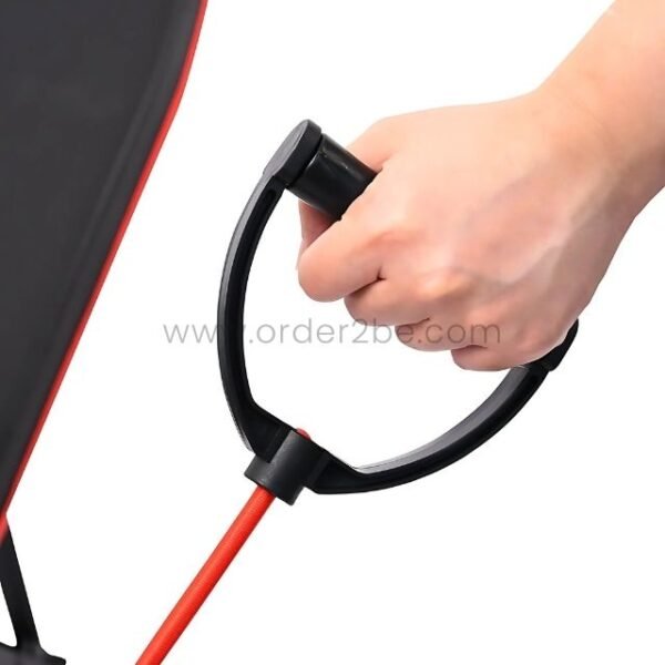 A hand gripping the handle of a resistance band attached to an adjustable full-body workout bench, demonstrating its versatility.