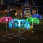 Jellyfish solar garden lights glowing in a warm backyard setting, adding color and charm to the evening.