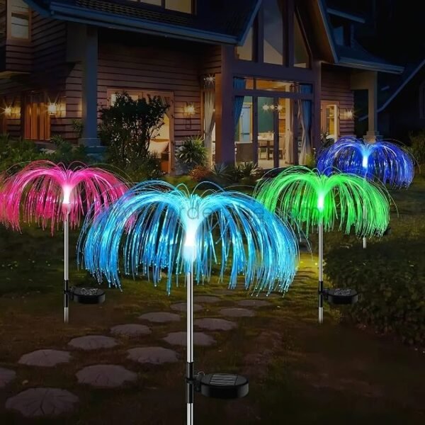 Jellyfish solar garden lights glowing in a warm backyard setting, adding color and charm to the evening.
