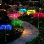 Jellyfish solar garden lights lining a stone garden path, creating a colorful and inviting trail.
