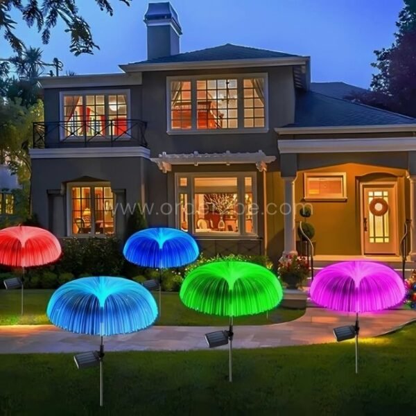 Jellyfish solar garden lights glowing outside a sleek contemporary house, adding color and charm.