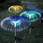 Colorful jellyfish solar garden lights glowing in a lush garden, adding playful, magical lighting.