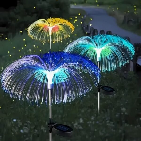 Colorful jellyfish solar garden lights glowing in a lush garden, adding playful, magical lighting.