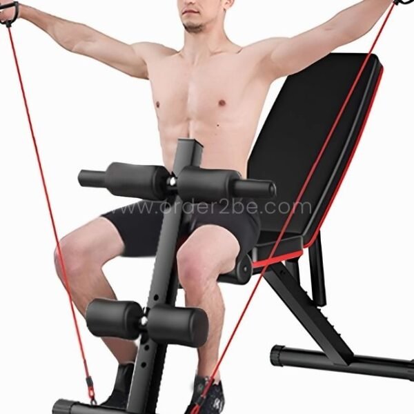 A man using the multi-functional home gym bench with resistance bands for an upper-body workout.