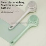 Two rechargeable rotating shower brushes in mint green and cream-colored finishes, showcasing their elegant design.