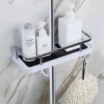Space-saving shower caddy in a modern bathroom, storing bath products and a fluffy bath puff.