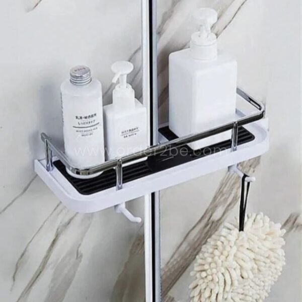 Space-saving shower caddy in a modern bathroom, storing bath products and a fluffy bath puff.