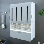 Grey wall-mounted spice and grain organizer installed in a clean, organized kitchen, highlighting its minimalist design and ease of use.
