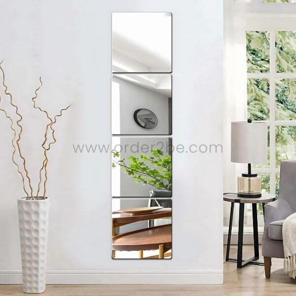Vertical stack of 30x30cm peel-and-stick mirror tiles reflecting cozy modern decor and soft daylight.