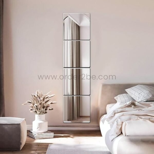 Four vertical 30x30cm mirror tiles reflecting a soft-lit, peaceful bedroom.