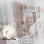 Close-up of white bed mosquito net showing durable mesh material and subtle texture.