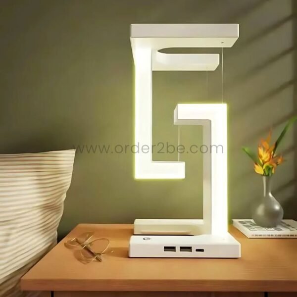 Modern dimmable desk lamp glowing softly in a minimalist room with neutral décor.