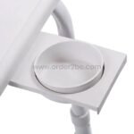 Close-up of the tray’s built-in cup holder holding a coffee mug securely.