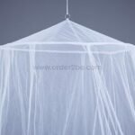 White bed mosquito net shown hanging against a neutral wall, highlighting its fine mesh and structure.