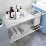Adjustable Shelf Organizer in a bathroom, holding towels, baskets, and decorative items.