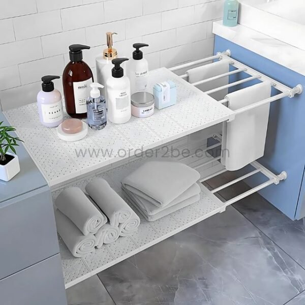 Adjustable Shelf Organizer in a bathroom, holding towels, baskets, and decorative items.
