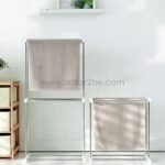 2-Tier laundry drying rack placed beside a shorter single-tier version in a minimalist room.
