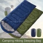 Green and blue portable sleeping bags next to their compact storage sacks, ideal for hiking and camping.