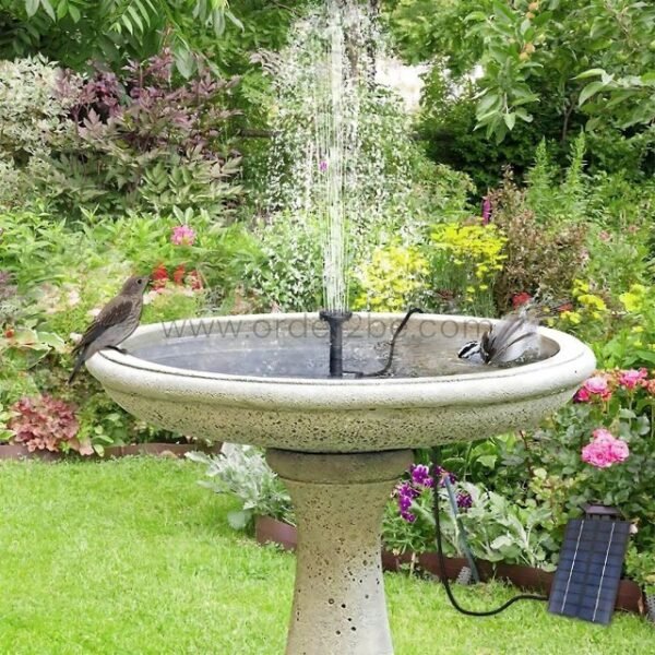 Solar-powered water fountain birdbath nestled in garden greenery, attracting birds and boosting biodiversity.