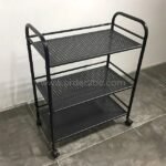Portable multi-shelf storage rack with wheels and a matte black finish on a tiled floor in a clean, modern room.