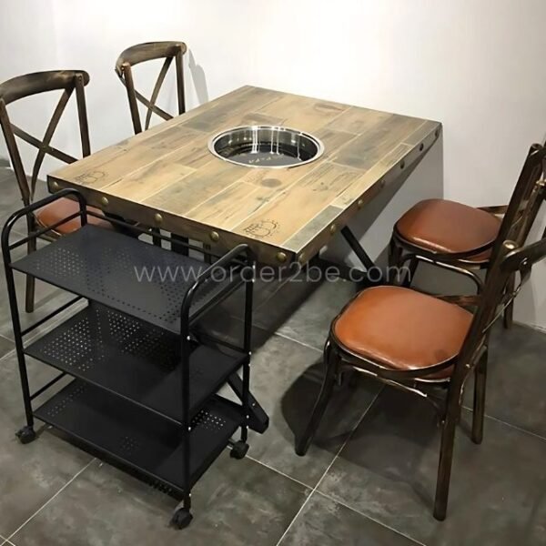 Portable multi-shelf storage rack with perforated metal shelves next to a grill table in a warm dining setup.