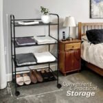 Portable multi-shelf storage rack (100cm tall, 60cm wide) with folded clothes, shoes, and a plant, placed by a nightstand.