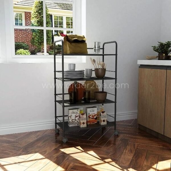 Portable multi-shelf storage rack holding plates, bowls, and snacks, set in a modern kitchen near a window.