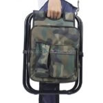 A person carrying a camouflage portable backpack chair on their back.