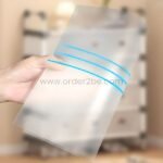 Transparent panel of the multi-tier shoe cabinet being held to show its durable, lightweight build.