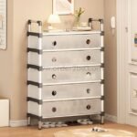 A transparent multi-tier shoe cabinet with five drawers placed in a cozy modern entryway.
