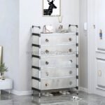 Transparent multi-tier shoe cabinet with five drawers placed in a modern home entryway.